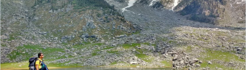 Man Standing on the banks of Kareri Lake